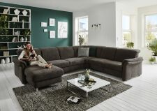 Sedací souprava GRANADA_ sestava CanGL-2,5EL-RE-2,5R_ rohové rozměry zleva 180 x 338 x 270 cm_ výška 83-106 cm_ volitelné funkce za příplatek_ v látce Belle anthrazit_ foto s modelem_ obr. 2 Sedací souprava GRANADA_ sestava CanGL-2,5EL-RE-2,5R_ rohové rozměry zleva 180 x 338 x 270 cm_ výška 83-106 cm_ volitelné funkce za příplatek_ v látce Belle anthrazit_ foto s modelem_ obr. 2