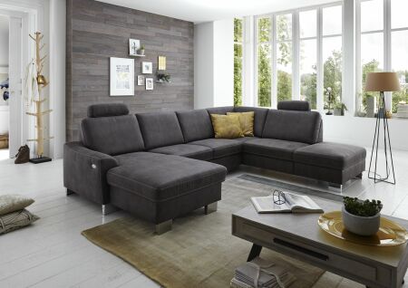 Sedací souprava STING-S_ sestava CanL_2,5EL_1,5KOR_ rohové rozměry zleva 167 x 313 x 235 cm_ volitelné funkce a polštáře za příplatek_ v látce Taurus grau_ foto s modelem_ obr. 11