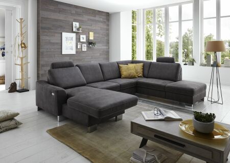 Sedací souprava STING-S_ sestava CanL_2,5EL_1,5KOR_ rohové rozměry zleva 167 x 313 x 235 cm_ volitelné funkce a polštáře za příplatek_ v látce Taurus grau_ foto s modelem_ obr. 12